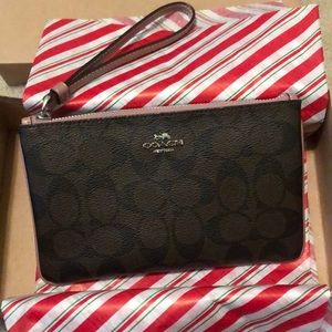 Coach wristlet with light purple/pink zipper